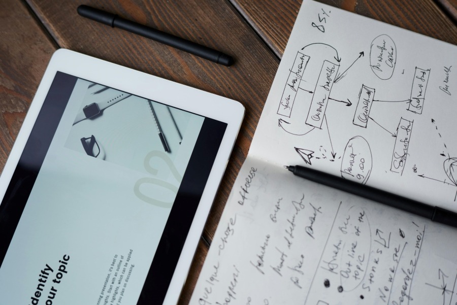 Small business owner notebook with ideas for growth